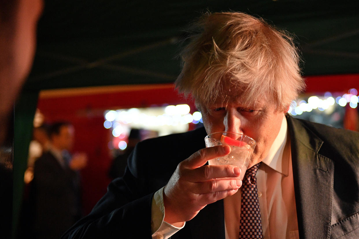 Prime Minister Boris Johnson samples an Isle of Harris Gin as he visits a UK Food and Drinks market which has been set up in Downing Street, London. Picture date: Tuesday November 30, 2021.