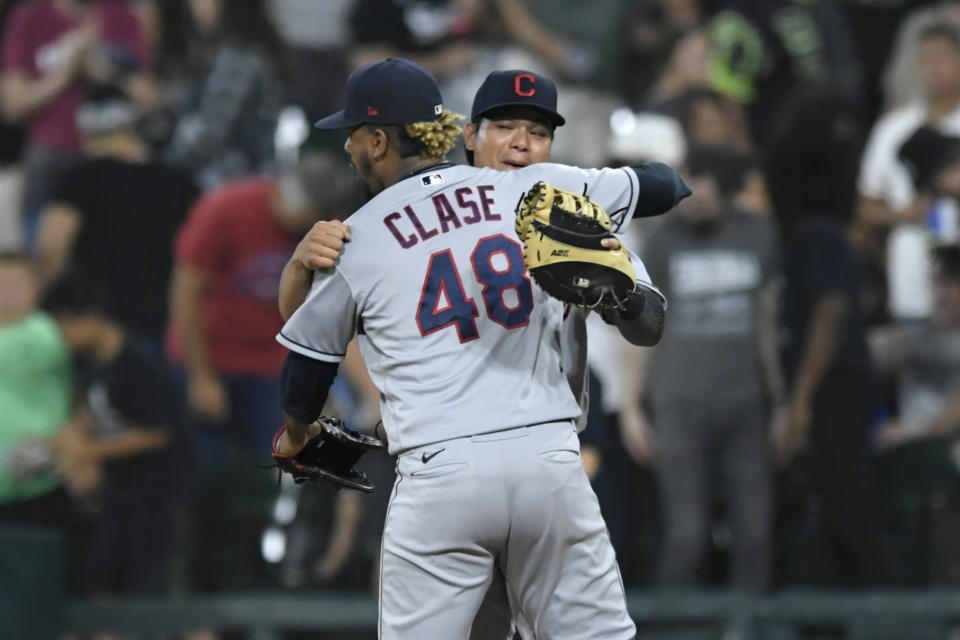 Cleveland Indians closing pitcher Emmanuel Clase (48) celebrates with first baseman Yu Chang after the Indians defeated the Chicago White Sox 12-11 in a baseball game Saturday, July 31, 2021, in Chicago. (AP Photo/Paul Beaty)