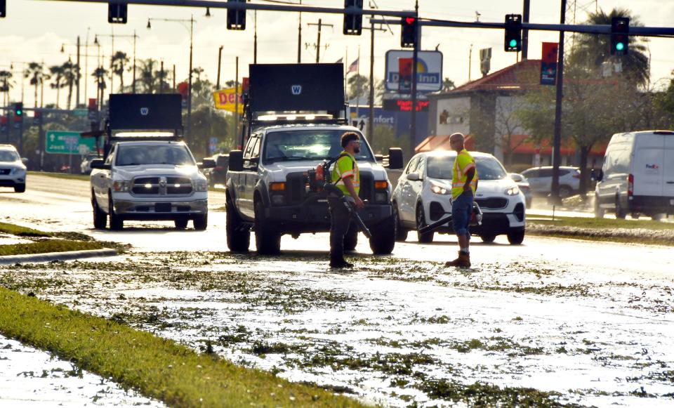  Clean up efforts on West New Haven Avenue. A strong thunderstorm and huge amount of hail hit southern Brevard on Wednesday, April 26, especially in the West Melbourne area, causing large sections of snow-like piles of hail, wind damage, and flooded parking lots.