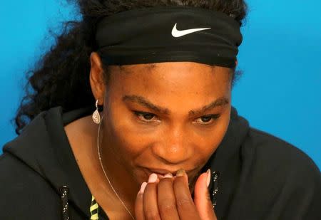 Serena Williams of the U.S. reacts during a news conference after losing her final match against Germany's Angelique Kerber at the Australian Open tennis tournament at Melbourne Park, Australia, January 30, 2016. REUTERS/John French