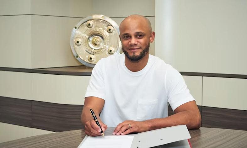 <span>Vincent Kompany signs his <a class="link " href="https://sports.yahoo.com/soccer/teams/bayern-munich/" data-i13n="sec:content-canvas;subsec:anchor_text;elm:context_link" data-ylk="slk:Bayern Munich;sec:content-canvas;subsec:anchor_text;elm:context_link;itc:0">Bayern Munich</a> contract after agreeing to replace Thomas Tuchel.</span><span>Photograph: FC Bayern</span>