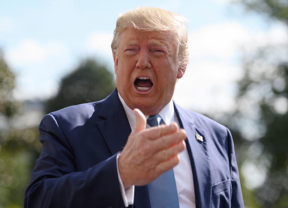 President Trump speaks to reporters as he departs the White House in Washington, D.C., on Friday. (Photo: Andrew Caballero-Reynolds/AFP via Getty Images)