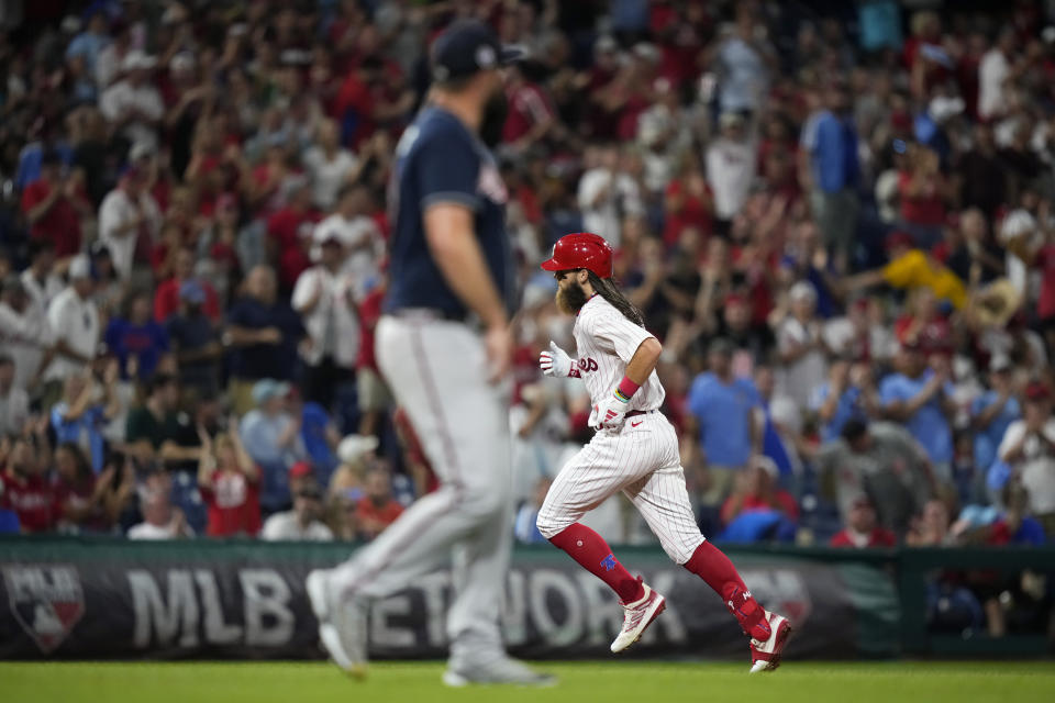 Philadelphia Phillies' Brandon Marsh, right, rounds the bases after hitting a home run against Atlanta Braves pitcher Jackson Stephens during the fifth inning of the second baseball game in a doubleheader, Monday, Sept. 11, 2023, in Philadelphia. (AP Photo/Matt Slocum)