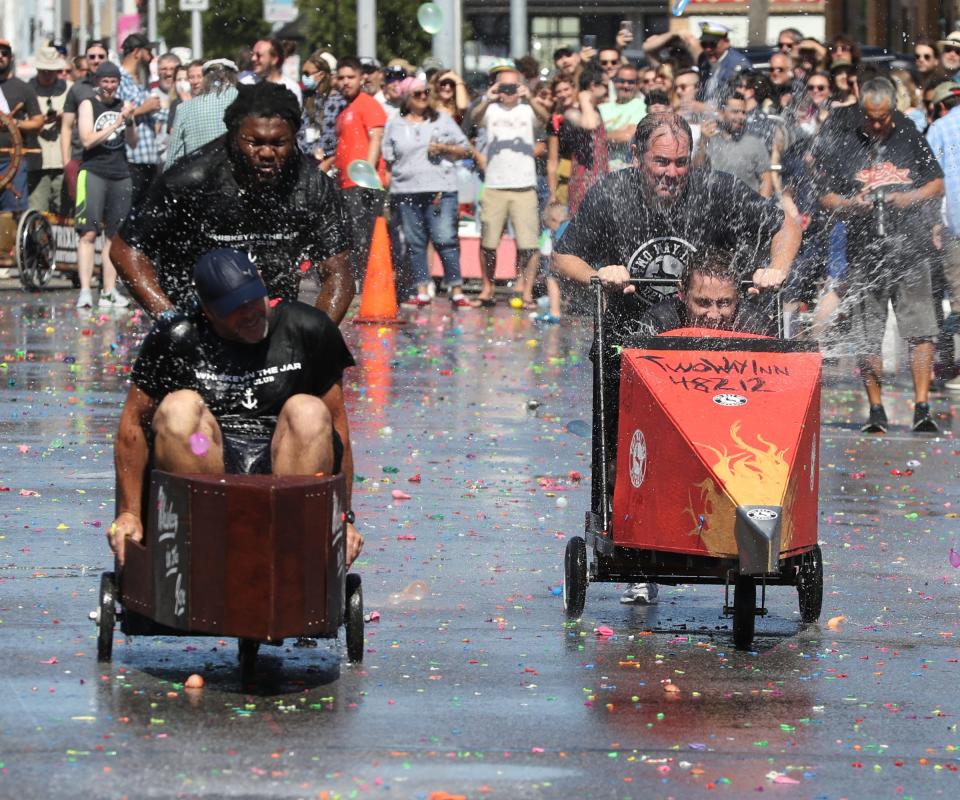 Festival goers got a chance to watch the Hamtramck Yacht Race on Monday, September 6, 2021. Teams of patrons from local bars race down Joseph Campau in carts shaped like boats while being pelted with water balloons. The two finalists Whiskey In The Jar and Two Way take off from the start line Whiskey In the Jar would go on to take first place.