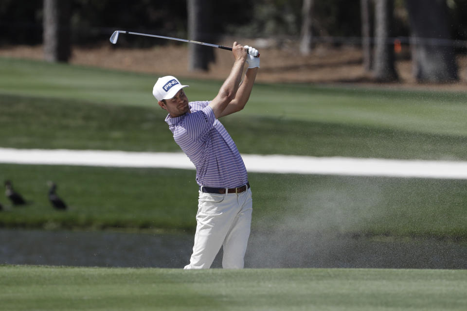 FILE - In this March 12, 2020, file photo, Harris English hits from a bunker on the seventh fairway during the first round of The Players Championship golf tournament in Ponte Vedra Beach, Fla. English started the season with limited status and is assured a full card for next season. (AP Photo/Chris O'Meara, File)