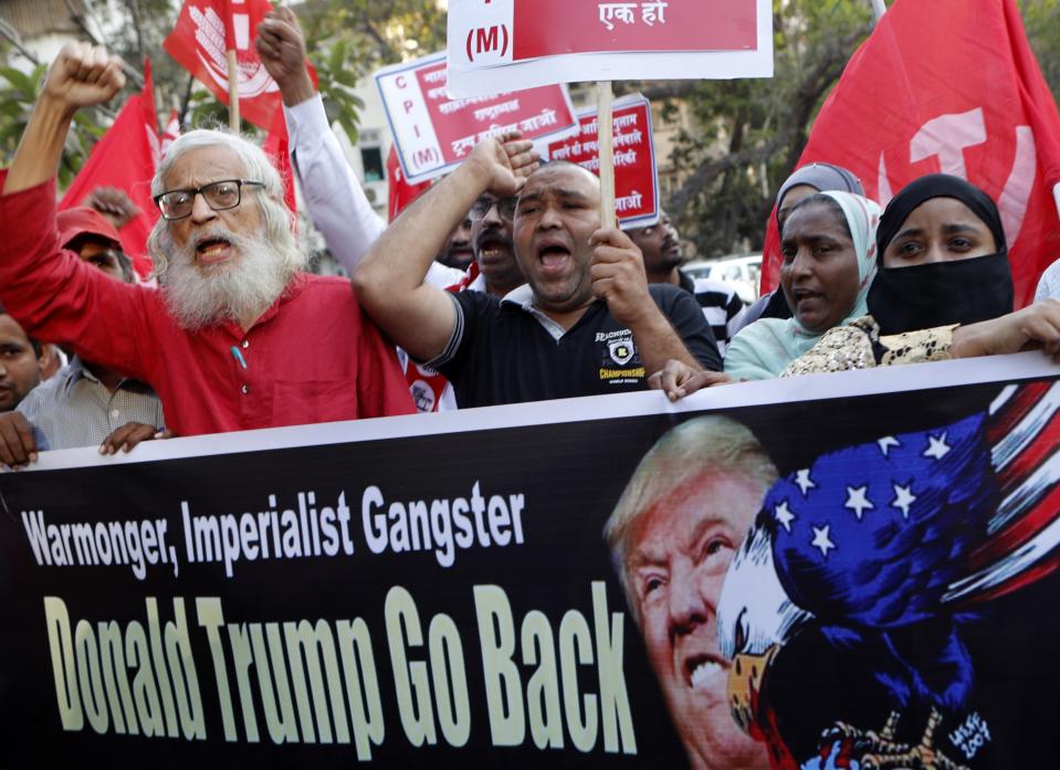 Supporters of the Communist Party of India -Marxist protest against the India visit of US President Donald Trump in Mumbai, India, Tuesday, Feb 25, 2020. (AP Photo/Rajanish Kakade)