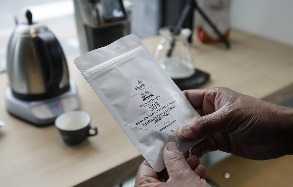 Klatch Coffee owner Bo Thiara shows a package of Elida Natural Geisha coffee. (Photo: AP)