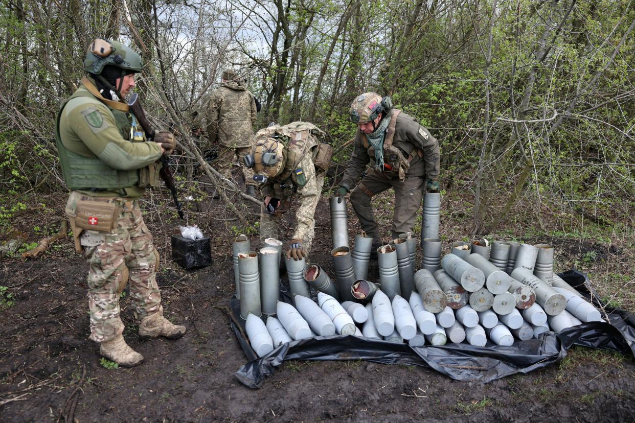 Ukrainian artillerymen of the Aidar battalion work with artillery shells on a front line position near Bakhmut, Donetsk region, on 22 April 2023 (AFP via Getty Images)