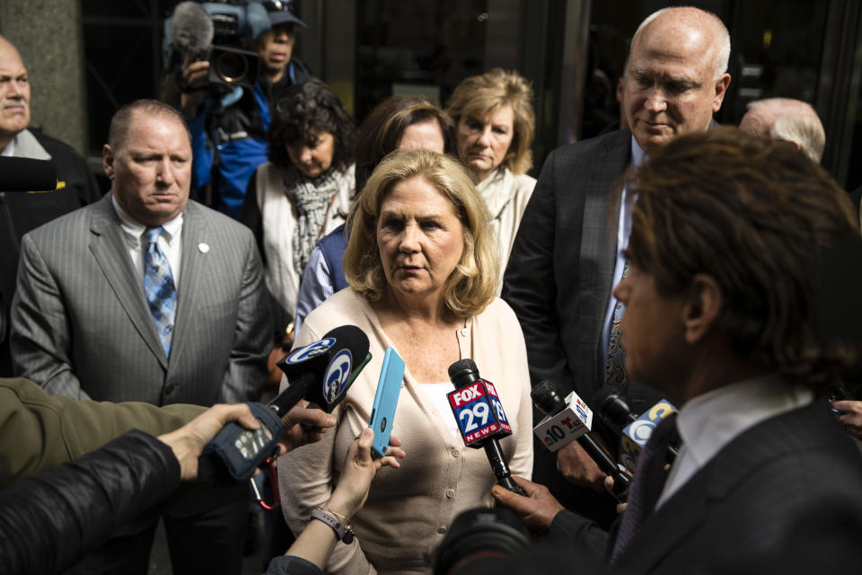 FILE - In this April 30, 2018 file photo Maureen Faulkner, the widow of slain Philadelphia police officer Daniel Faulkner, speaks with members of the media after a hearing for Mumia Abu-Jamal, convicted in the 1981 murder of her husband, in Philadelphia. The city of Philadelphia is poised to revisit one of its most contentious murders as prison activist Mumia Abu-Jamal fights for another day in court in a 1981 police slaying. Maureen Faulkner fears she will never find closure in the criminal justice system after nearly 40 years. She filed a petition Thursday, Sept. 19, 2019 to get Philadelphia District Attorney Larry Krasner’s office recused from the case after Krasner failed to oppose Abu-Jamal’s bid for a new court hearing.(AP Photo/Matt Rourke, File)