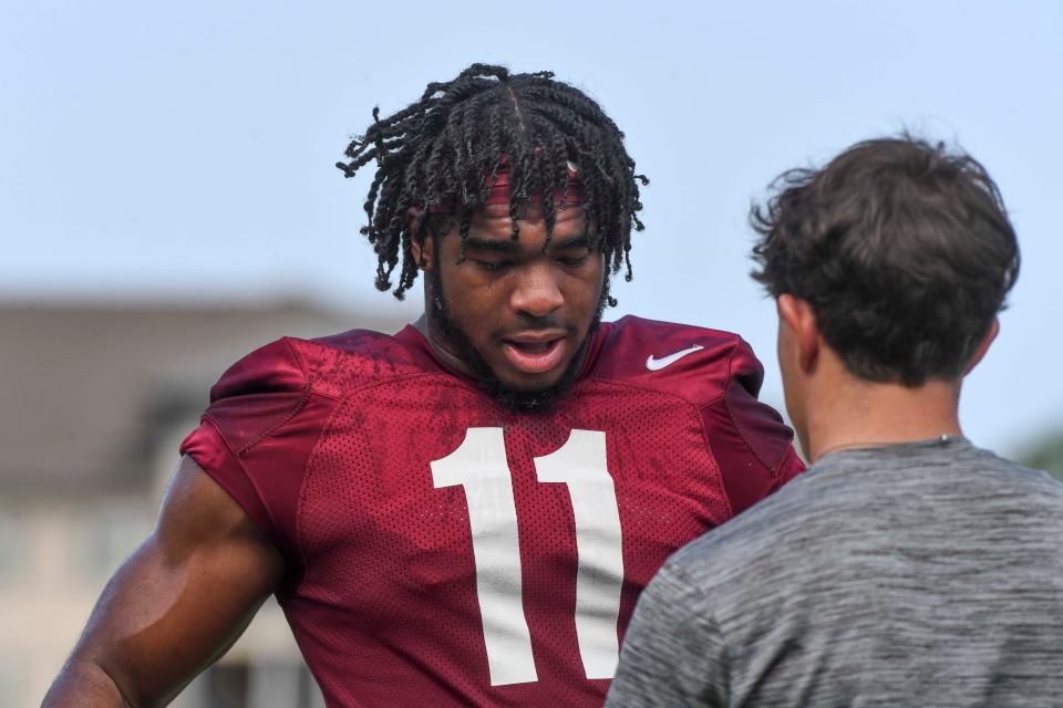 The Crimson Tide football team continued practice on Thursday, August 1, 2024 as it prepares for the season opener and first game under new head coach Kalen DeBoer. Alabama linebacker Jihaad Campbell (11) cools down during a break.