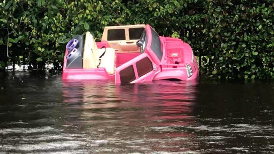 A plastic toy car is washed up along the side of a flooded road near 67th Avenue in Hialeah on November 10, 2020.