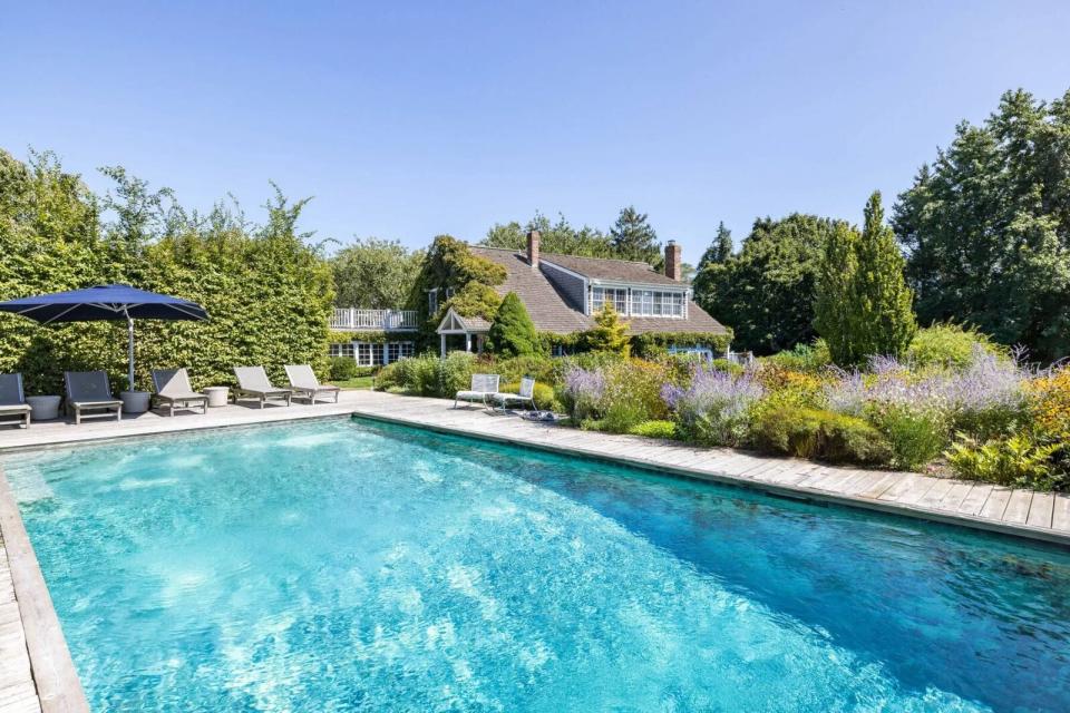 Set on 1.7 acres in the heart of Sagaponack, the converted barn beams with daylit living areas, lush grounds, a detached guesthouse, and a secluded pool.
