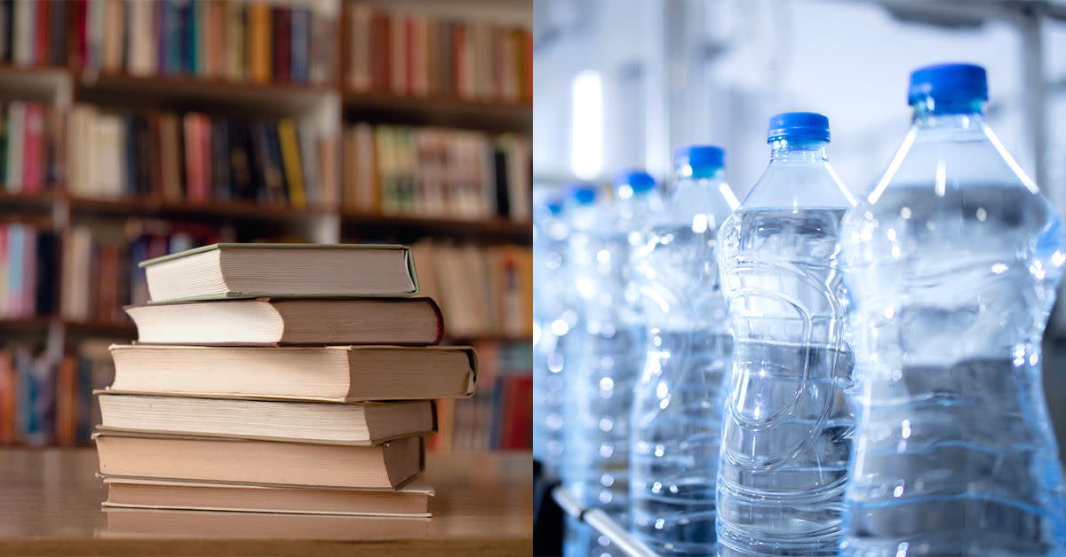 An image of a stack of college textbooks next to bottled waters.