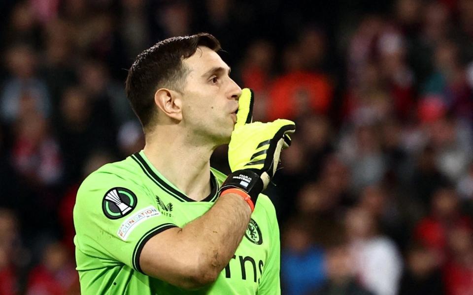 Emiliano Martinez celebrates saving Lille's Nabil Bentaleb penalty during the penalty shootout