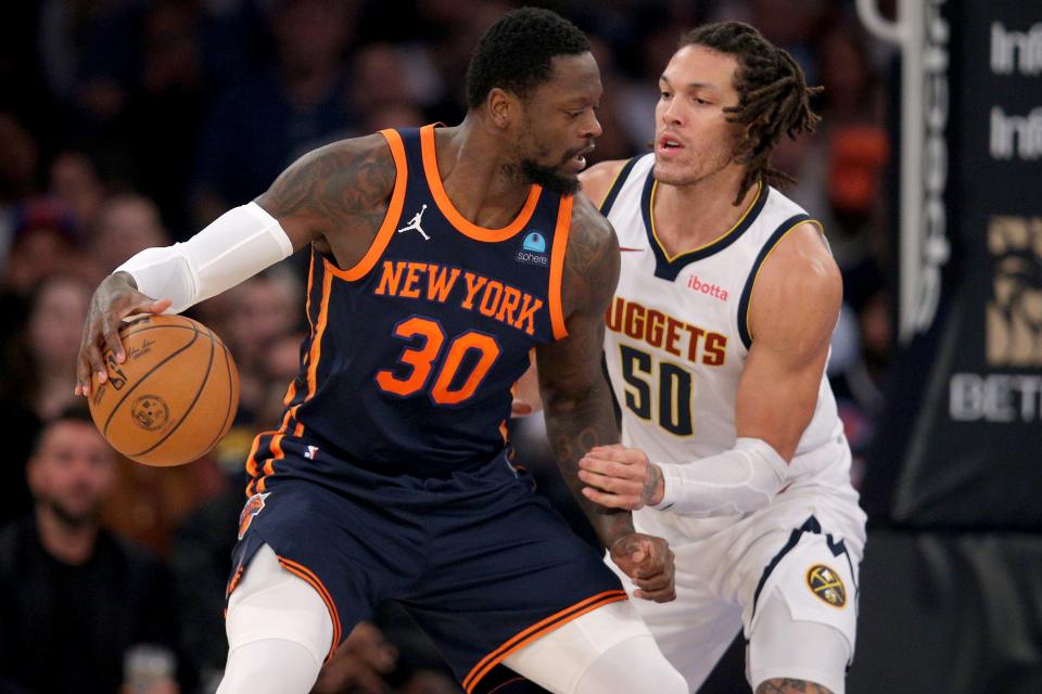 Jan 25, 2024; New York, New York, USA; New York Knicks forward Julius Randle (30) controls the ball against Denver Nuggets forward Aaron Gordon (50) during the first quarter at Madison Square Garden. Mandatory Credit: Brad Penner-USA TODAY Sports