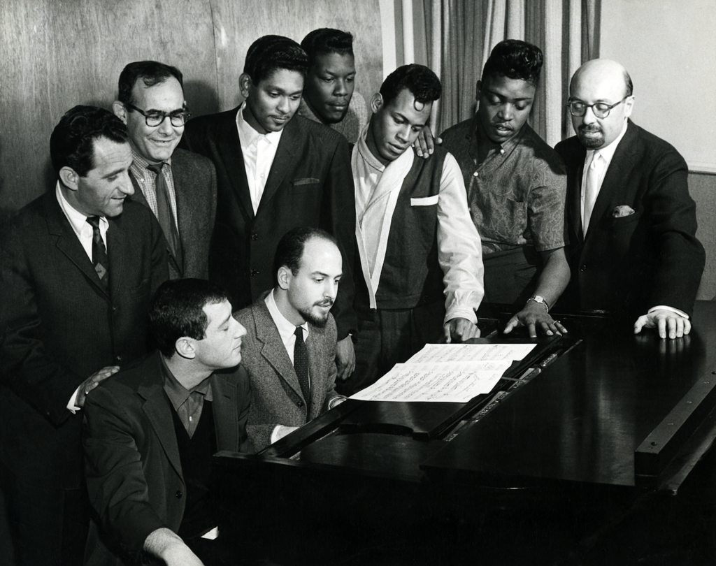 Jerry Leiber and Mike Stoller (on piano bench) with the Coasters, Lester Sill and Ahmet Ertegun (far right) - Credit: Courtesy Mike Stoller Archives