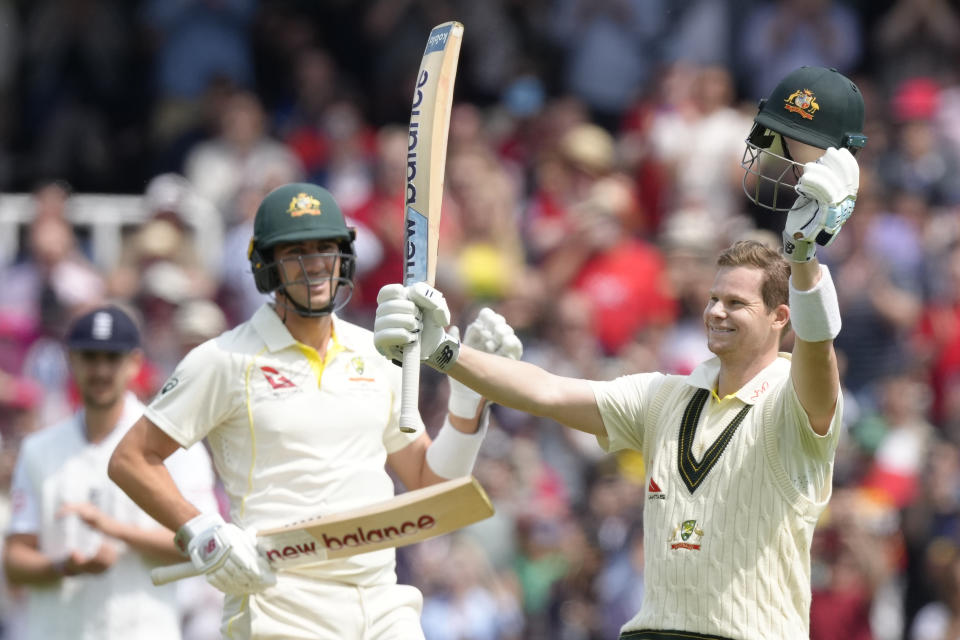 Australia's Steven Smith, right, celebrates getting 100 runs not out on the second day of the second Ashes Test match between England and Australia, at Lord's cricket ground in London, Thursday, June 29, 2023. (AP Photo/Kirsty Wigglesworth)