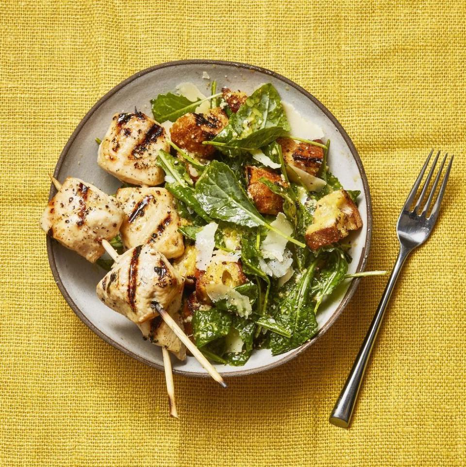 <p>Light and creamy Caesar salad gets a protein boost with grilled chicken skewers in this simple summer meal, ready in under 30 minutes. </p><p>Get the <strong><a href="https://www.goodhousekeeping.com/food-recipes/a36174512/grilled-chicken-skewers-and-kale-caesar-recipe/" rel="nofollow noopener" target="_blank" data-ylk="slk:Grilled Chicken Skewers and Kale Caesar recipe" class="link ">Grilled Chicken Skewers and Kale Caesar recipe</a></strong>. </p><p><strong>RELATED:</strong> <a href="https://www.goodhousekeeping.com/food-recipes/easy/g2352/quick-summer-dinner-recipes/" rel="nofollow noopener" target="_blank" data-ylk="slk:77 Quick Summer Dinner Ideas for an Easy Weeknight Meal" class="link ">77 Quick Summer Dinner Ideas for an Easy Weeknight Meal</a></p>