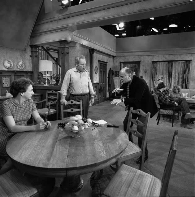 Lear (right) speaks with Jean Stapleton and Carroll O'Connor on the set of 