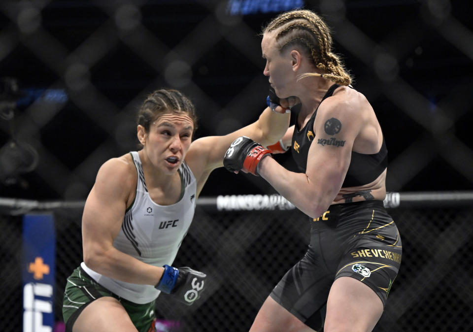 Alexa Grasso, left, jabs Valentina Shevchenko during a UFC 285 mixed martial arts flyweight title bout Saturday, March 4, 2023, in Las Vegas. (AP Photo/David Becker) ORG XMIT: NVDB140