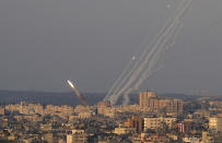 FILE - Rockets are launched from the Gaza Strip towards Israel, in Gaza City, Sunday, Aug. 7, 2022. Close to one-third of the Palestinians who died in the latest outbreak of violence between Israel and Gaza militants may have been killed by errant rockets fired by Islamic Jihad fighters, according to an Israeli military assessment that appears consistent with independent reporting by The Associated Press. (AP Photo/Hatem Moussa, File)