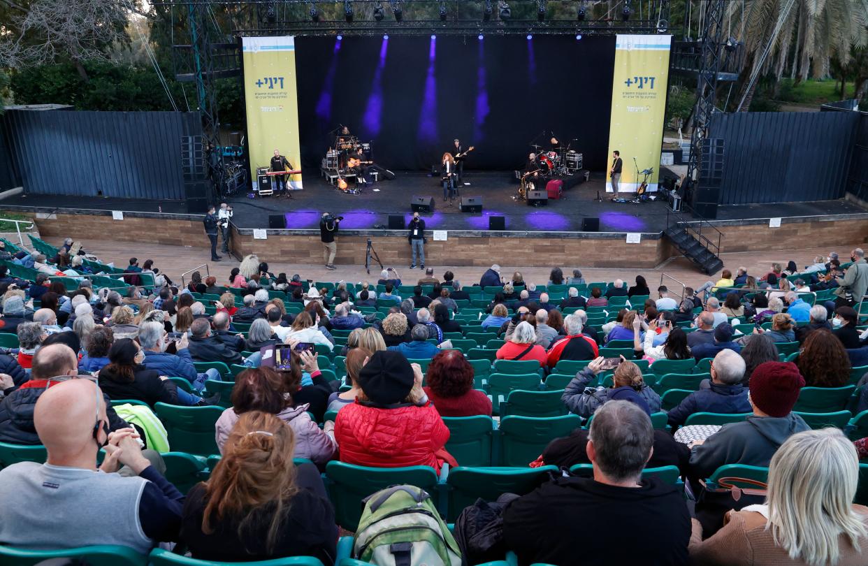 Israelis watching a concert after showing their 