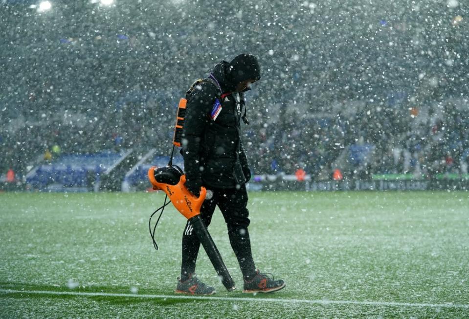A member of Leicester’s ground staff used a leaf blower to clear the lines at the King Power Stadium (Tim Goode/PA) (PA Wire)