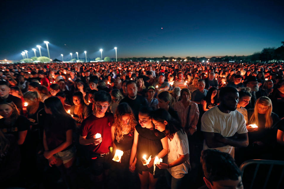 <p>People attend a candlelight vigil for the victims of the Wednesday shooting at Marjory Stoneman Douglas High School, in Parkland, Fla., Thursday, Feb. 15, 2018. (Photo: Gerald Herbert/AP) </p>