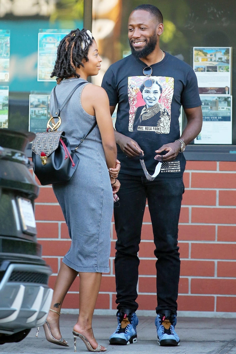 <p><i>New Girl </i>star Lamorne Morris wears a shirt featuring Rosa Parks’ face while chatting with a friend on Wednesday in Los Angeles. </p>