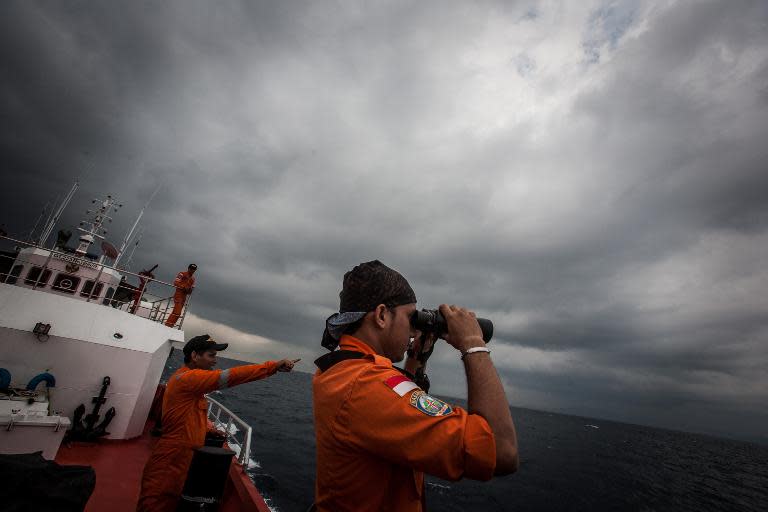 Indonesian national search and rescue agency staff keep watch for missing Malaysia Airlines Flight MH370, in the Andaman Sea, on March 15, 2014