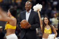 FILE - Retired Denver Nuggets forward Alex English carries out the game ball for the opening tip-off between the Nuggets and the Brooklyn Nets in an NBA basketball game Friday, Feb. 24, 2017, in Denver. Now, with the Nuggets the top-seed in the Western Conference, Denver has never seemed to be mistaken for much beyond an NBA novelty. And if there really is gold at the end of all those rainbows, a real Nuggets fan will have to see it to believe it. (AP Photo/David Zalubowski, File)