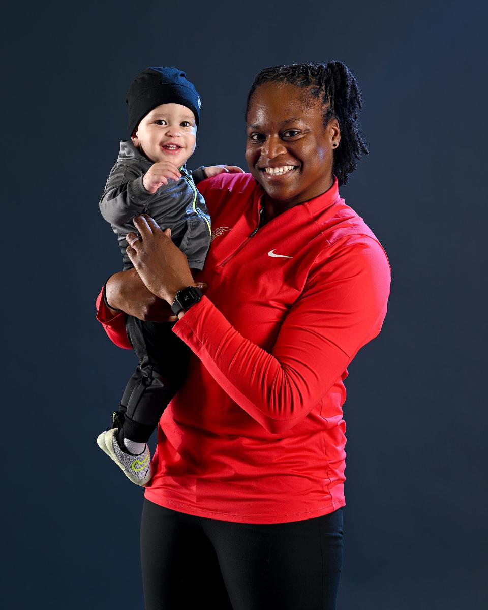 Indiana Fever Assistant Coach Karima Christmas-Kelly poses with her son, Zayn, at media day on May 1.