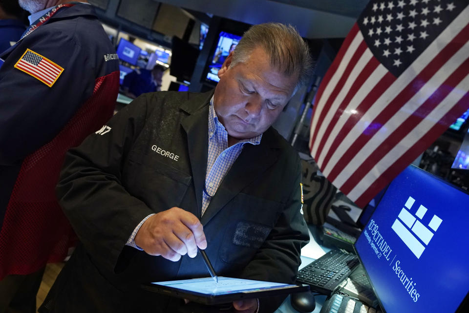 Trader George Ettinger works on the floor of the New York Stock Exchange, Wednesday, Sept. 22, 2021. Stocks rose broadly on Wall Street Wednesday ahead of an update from the Federal Reserve on how and when it might begin easing its extraordinary support measures for the economy. (AP Photo/Richard Drew)