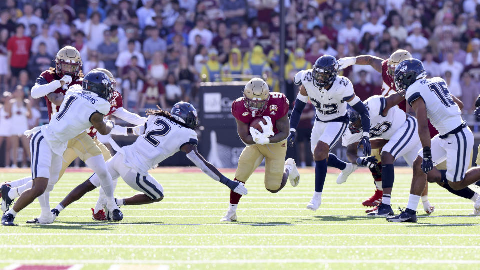 Boston College Eagles running back Kye Robichaux (5) cuts through the UConn defense during the first half of an NCAA college football game Saturday, Oct. 28, 2023 in Boston. (AP Photo/Mark Stockwell)