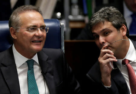 President of the Brazilian Senate Renan Calheiros (L) listens to Senator Lindberg Farias during the debate session for the voting of the impeachment of President Dilma Rousseff in Brasilia, Brazil, May 11, 2016. REUTERS/Ueslei Marcelino