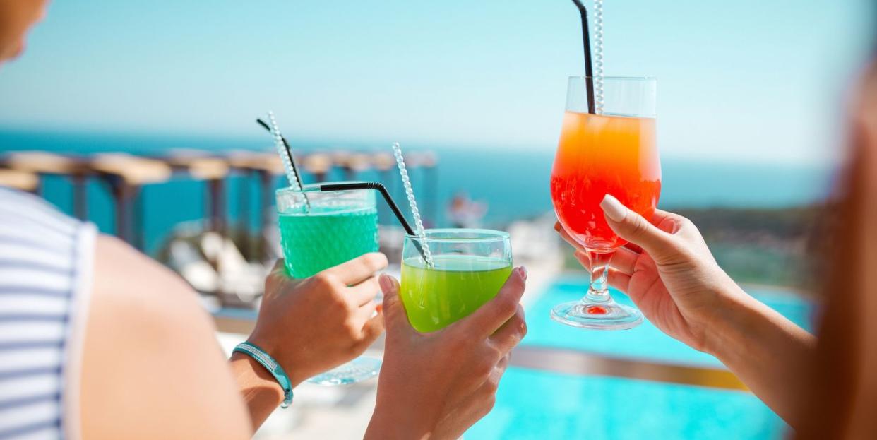 celebrating good moments in life with cocktails on the terrace in the summer resort