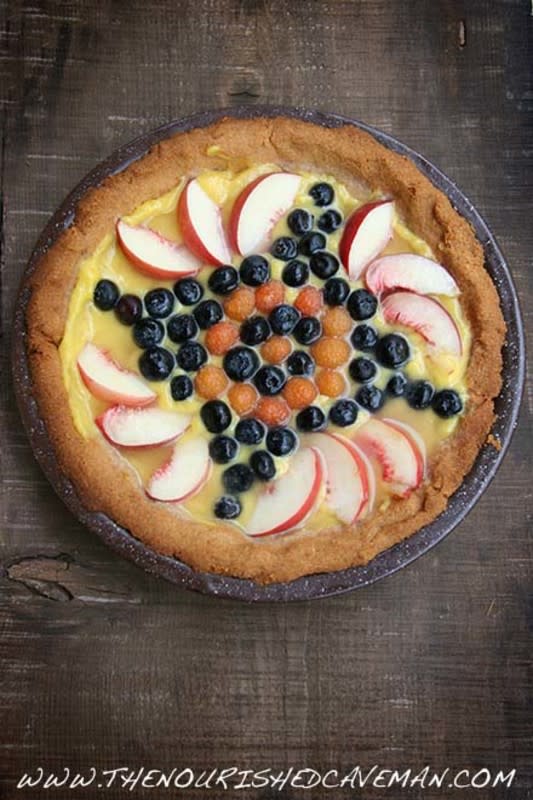 <p>The Nourished Caveman</p><p>Enjoy the fresh flavors of springtime with the delicious taste of this Fruit Tart filled with lemon curd and topped with fresh berries!</p><p><a href="https://thenourishedcaveman.com/keto-fruit-tart" rel="nofollow noopener" target="_blank" data-ylk="slk:Get the recipe!;elm:context_link;itc:0;sec:content-canvas" class="link rapid-noclick-resp">Get the recipe!</a></p>