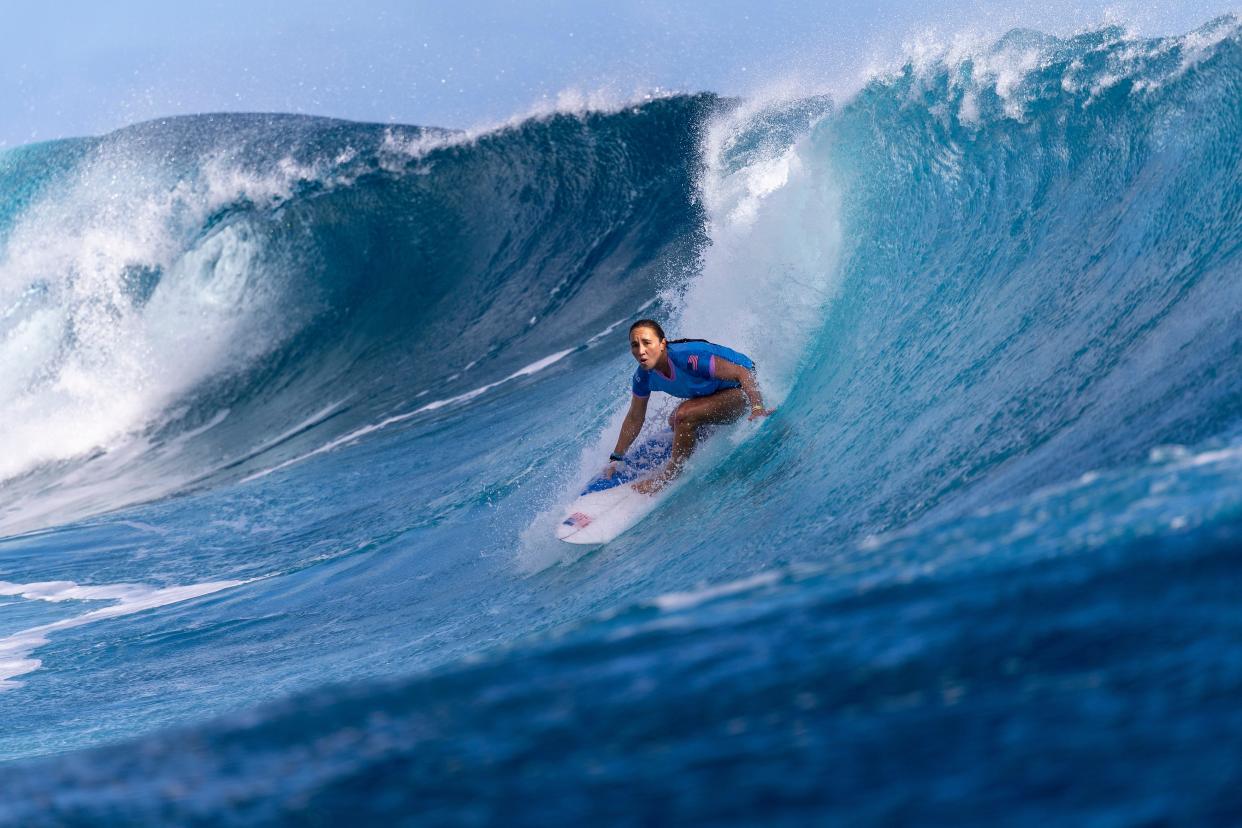 Carissa Moore rides a wave during the surfing quarterfinals in Teahupo'o, French Polynesia.