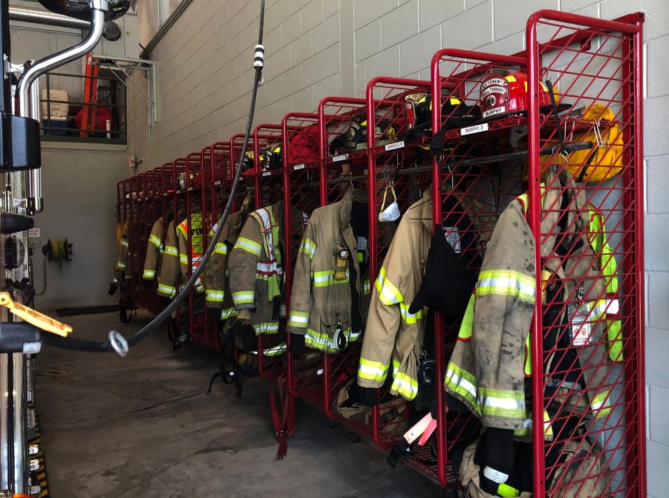 Firefighters' gear and equipment hangs inside the Kimball Township Fire Department on Allen Road in Kimball Township on Monday, May 23, 2022.