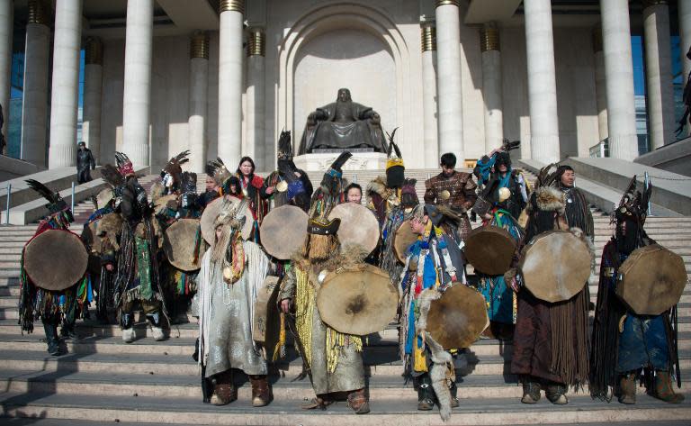 Mongolian shamans in fur and feather headdresses protest against a Canadian mining project they claim threatens ancient grave sites, in Ulan Bator