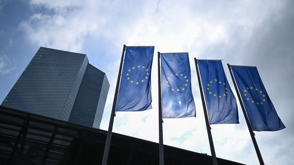 European Union flags fly in front of the European Central Bank in Frankfurt, earlier this year. While EU leaders agree that more money should go to arming Ukraine, there have been divisions over how to finance it. - Kirill Kudryavtsev/AFP/Getty Images