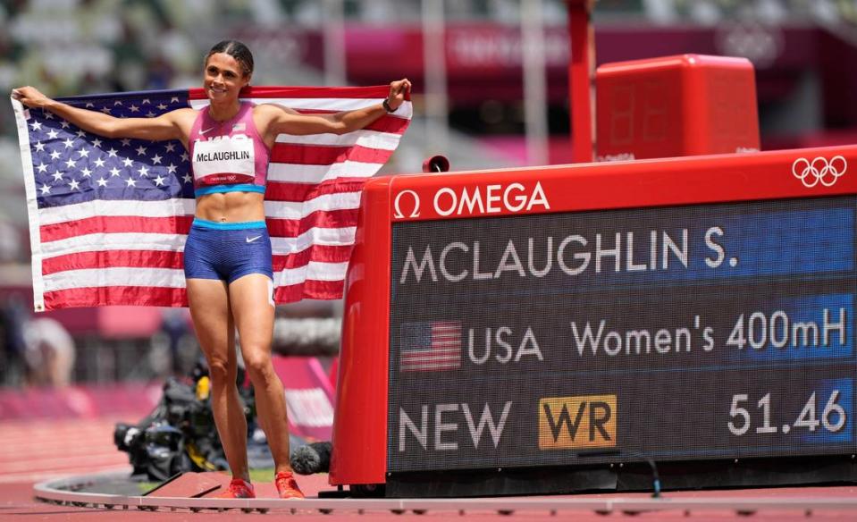 Sydney McLaughlin of the United States celebrates after winning the gold medal in world record time in the finals of the women’s 400-meter hurdles at the Summer Olympics in Tokyo.