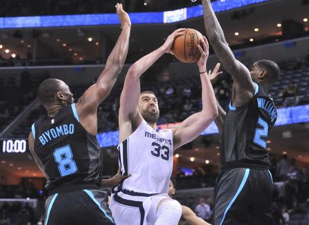 Jan 23, 2019; Memphis, TN, USA; Memphis Grizzlies center Marc Gasol (33) drives to the basket against Charlotte Hornets center Bismack Biyombo (8) and forward Marvin Williams (2) during the second half at FedExForum. Charlotte defeated Memphis 118-107. Mandatory Credit: Justin Ford-USA TODAY Sports