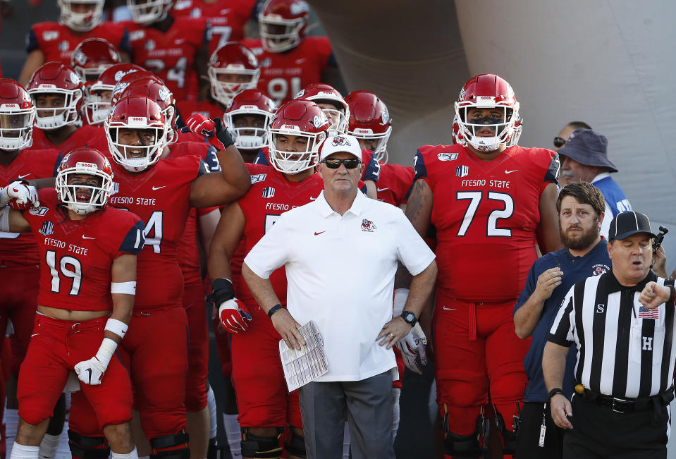 FILE - Fresno State coach Jeff Tedford leads his team in against Colorado State during the first half of an NCAA college football game in Fresno, Calif., Oct. 26 2019. Fresno State goes for the L.A. double over two seasons when it visits Lincoln Riley’s USC Trojans on Sept. 17, 2022. (AP Photo/Gary Kazanjian, File)