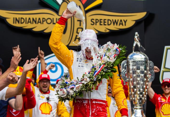 Josef Newgarden celebrates with milk after winning the Indianapolis 500 at Indianapolis Motor Speedway.