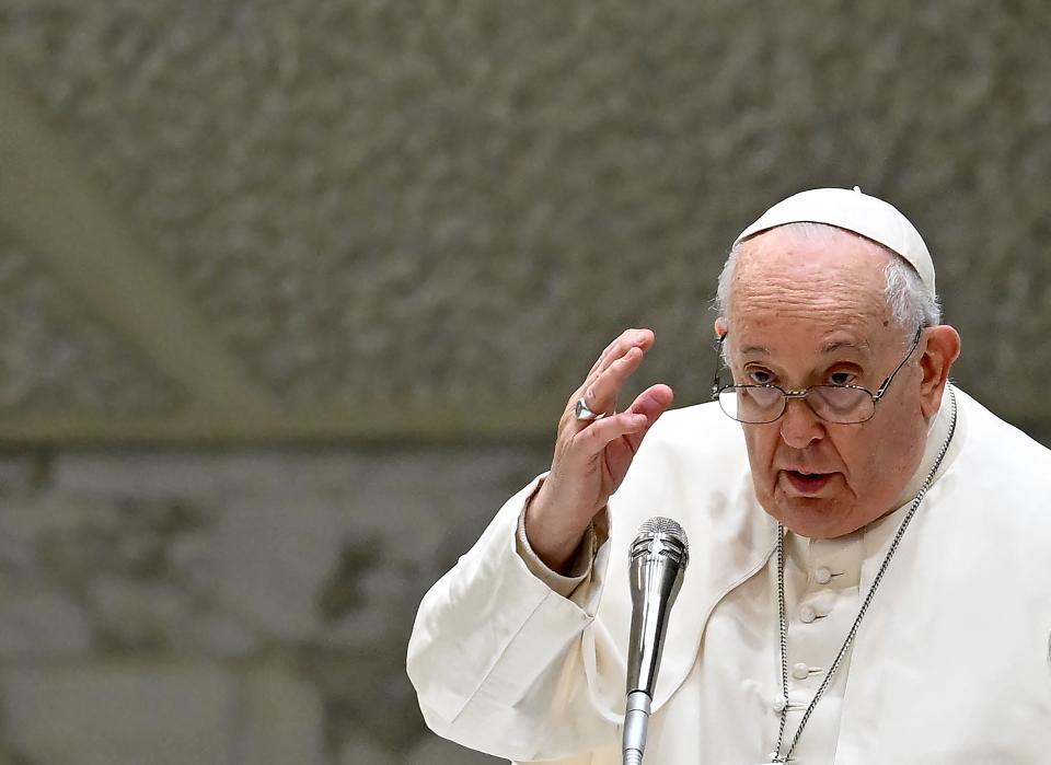 Pope Francis gives his blessing during the weekly general audience in Paul VI Hall at the Vatican on January 3, 2024.