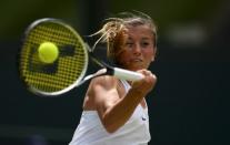 Britain Tennis - Wimbledon - All England Lawn Tennis & Croquet Club, Wimbledon, England - 3/7/16 Germany's Annika Beck in action against USA's Serena Williams REUTERS/Tony O'Brien