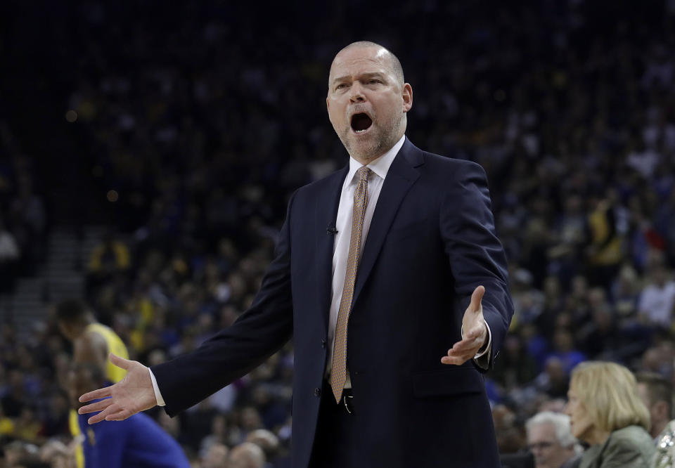 Denver Nuggets head coach Michael Malone yells during the first half of an NBA basketball game against the Golden State Warriors in Oakland, Calif., Tuesday, April 2, 2019. (AP Photo/Jeff Chiu)