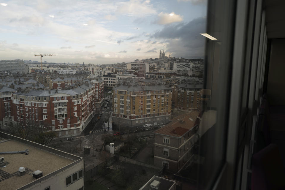 A view of the Sacre Coeur Basilica on Montmartre hill from the hospital room window of Lolita Andela and Caroline Erganian on the eve of their surgery at Bichat Hospital, AP-HP, in Paris Tuesday, Dec. 1, 2020. After multiple false dawns, they scarcely dare believe that their Paris hospital, no longer overwhelmed by COVID-19 patients, is now once again able to perform their weight-reducing intestinal tucks. When the epidemic was burning through hospital resources, the women's operations were pushed back time and again. (AP Photo/Francois Mori)