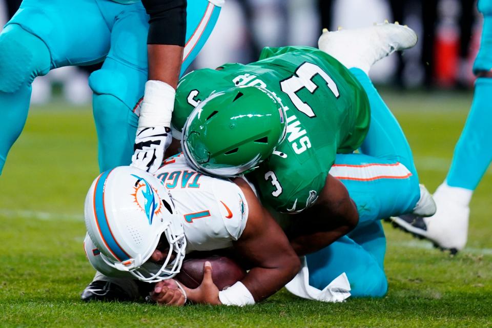 Philadelphia Eagles linebacker Nolan Smith (3) sacks Miami Dolphins quarterback Tua Tagovailoa (1) during the first half of an NFL football game Sunday, Oct. 22, 2023, in Philadelphia.